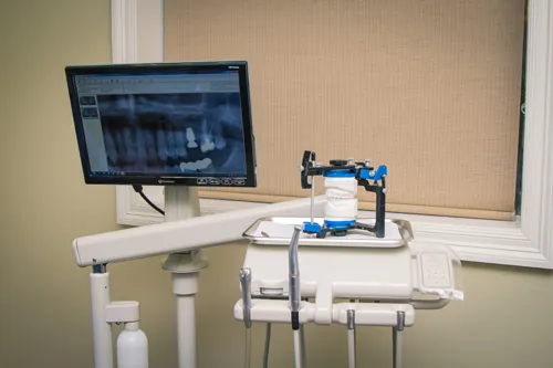 A treatment room at Mayatte Family Dentistry with a chair-side monitor